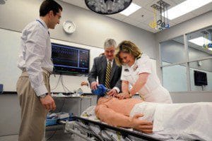 A doctor and nurse perform CPR