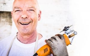 A man holding an electric saw may need First-Aid one day.